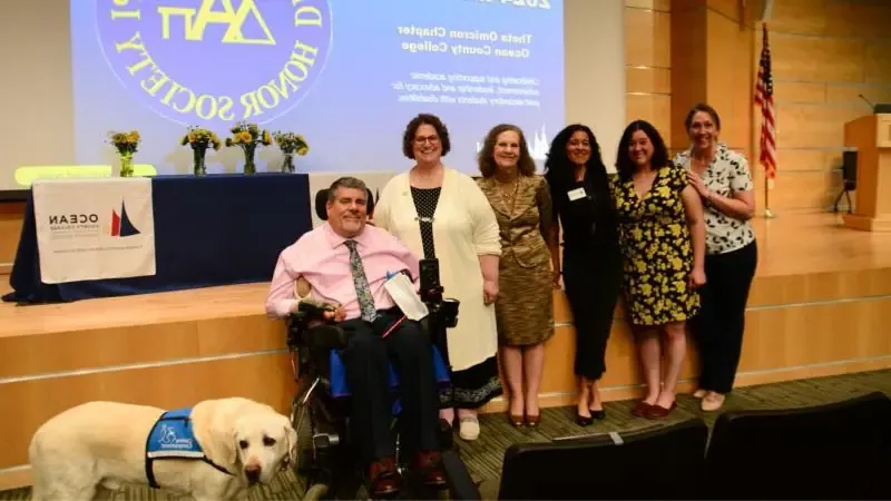 Group of students and staff at Delta Alpha PI Honor Society